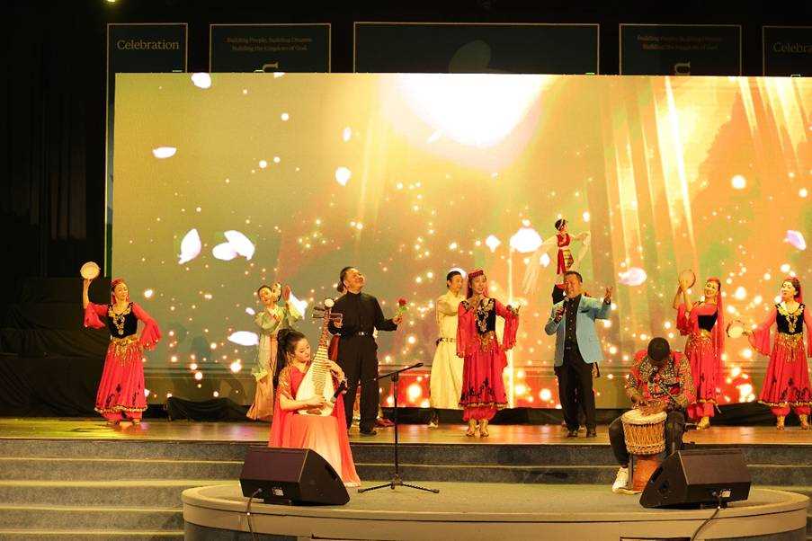A group of people performing on stage
AI-generated content may be incorrect.